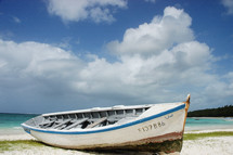 beached boat on sand 