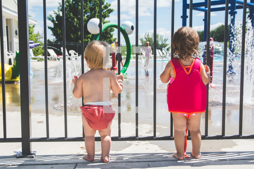 toddlers at a splash park 