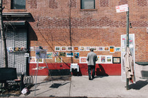 photographer selling photographs on a street 