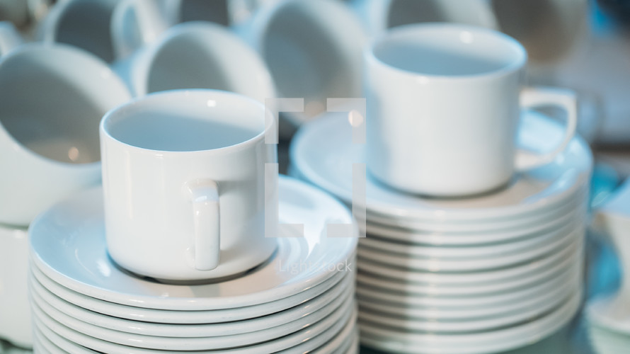 stacked plates and mugs 