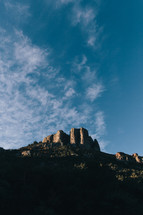peaks and rock formations against a blue sky