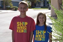 children wearing VBS 2018 t-shirts standing outdoors 