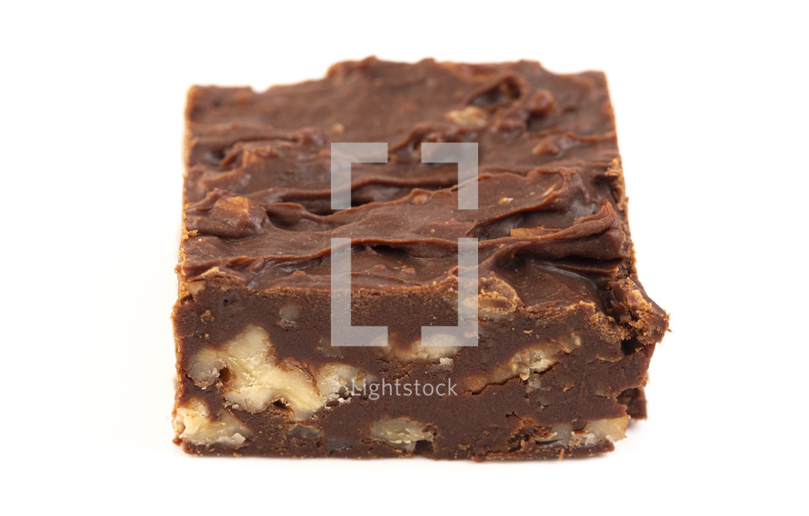 Fudge with walnuts on white background