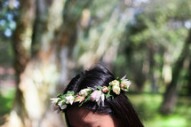 woman with flowers in her hair 