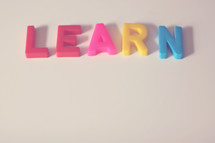Block letters spelling "learn."