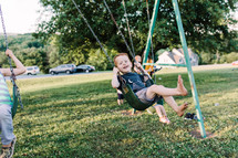 kids on a swing set 