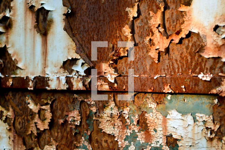 Old peeling rusty metal wall