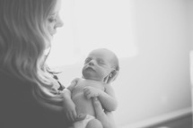 A mother holding a newborn 