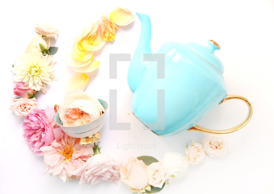 tea pot, tea cup, and flowers 