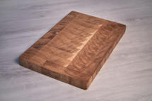 handmade oak cutting board on a grey background