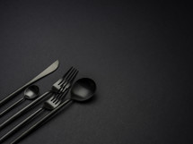 silverware on a black background 