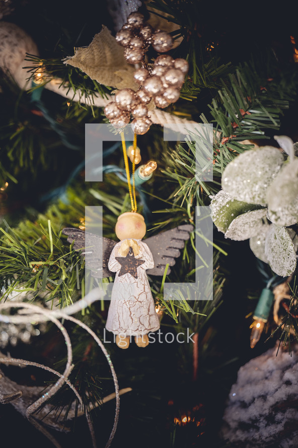 Wooden angel ornament on a Christmas tree