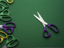 scissors on a green background 