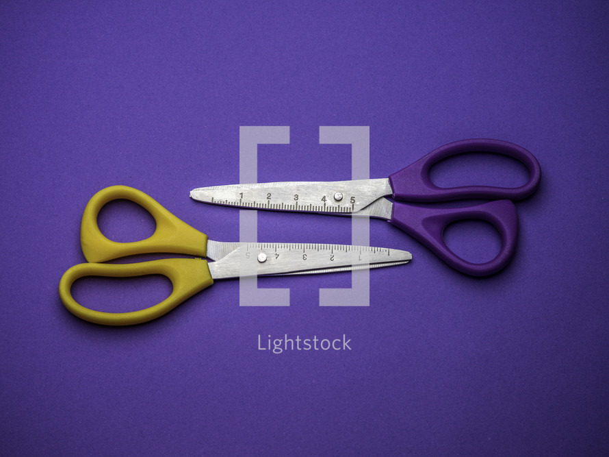 scissors on a purple background 