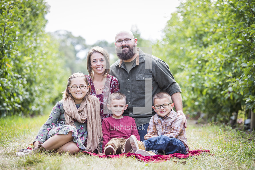 family portrait in an apple orchard 