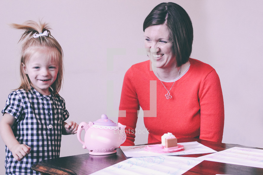 mother and daughter having a tea party 
