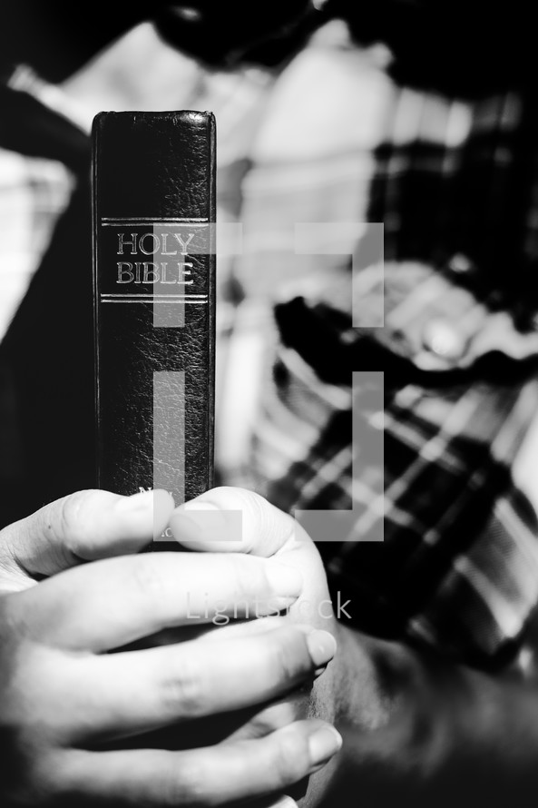 holding a Bible close to your heart