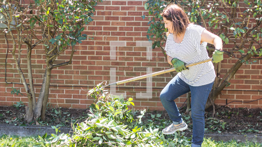 volunteers doing yard work at church 
