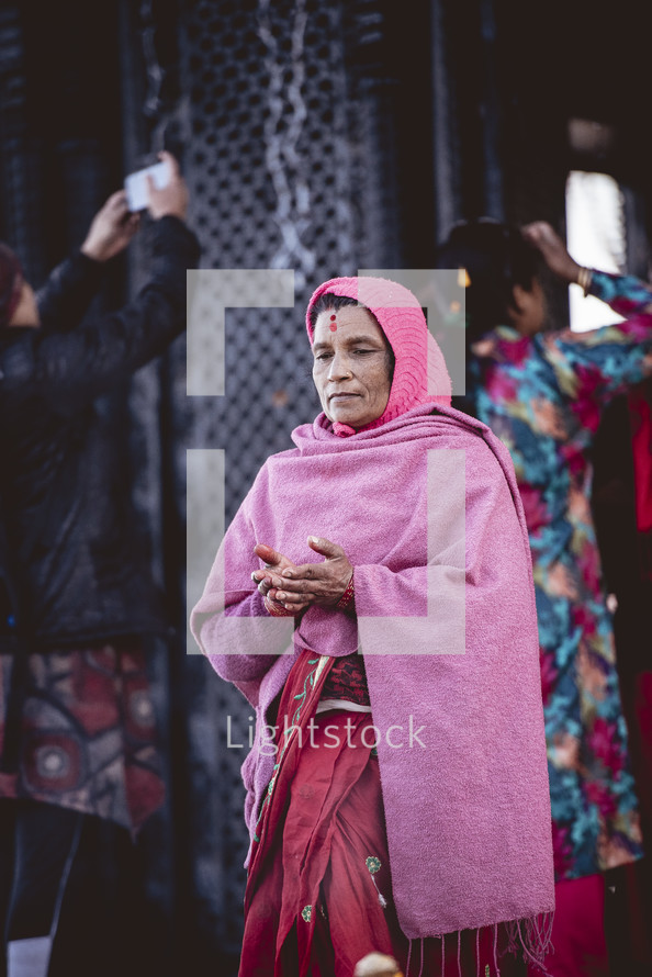 woman praying in Tibet