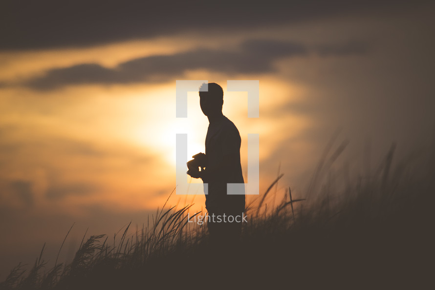 silhouette of a man at sunset 