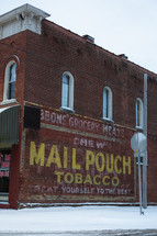 An old tobacco sign painted on the side of a building