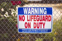 Warning no Life guard on duty sign 