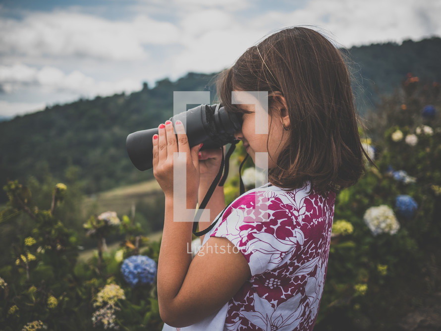 A little girl with binoculars 