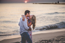 couple kissing on a beach 