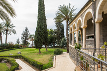 grass and walkways in the yard of an ancient church in the holy land 