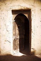 door on a clay wall 