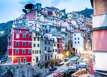 colorful houses and building on the side of a mountain in Italy 