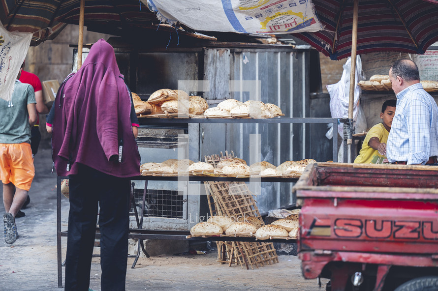 bread for sale at an outdoor market in Egypt 