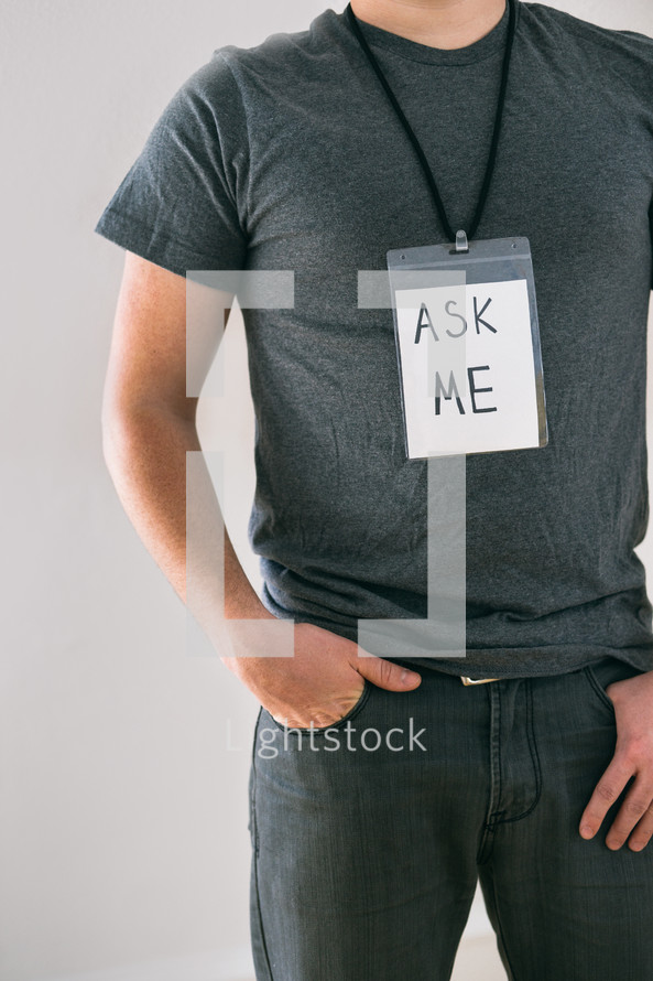 man wearing an Ask Me name badge 