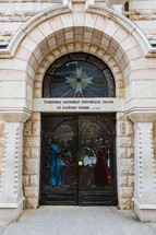 carved wooden door on a church in Jerusalem - Door to Church of St. Peter in Jerusalem