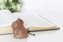 chocolate bunny and an opened Bible 