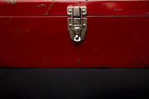 red toolbox on a black background 
