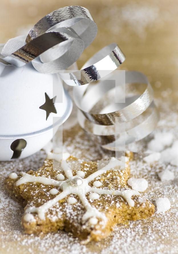star Christmas cookie and bell with ribbon 