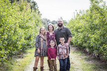 family portrait in an orchard 