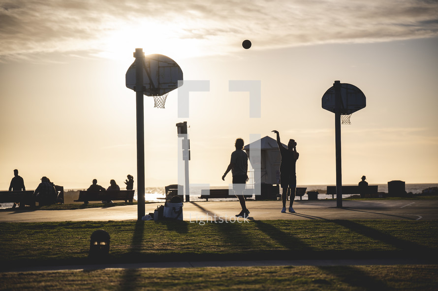 basketball courts on Newport beach at sunset 