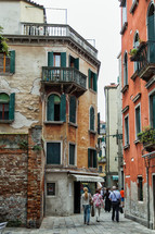 pedestrians walking through Venice 