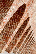The arches of an old fortress wall. Dutch angle
