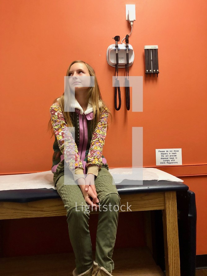 A child waiting at the doctors office 