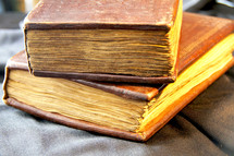 stack of old hand made bibles