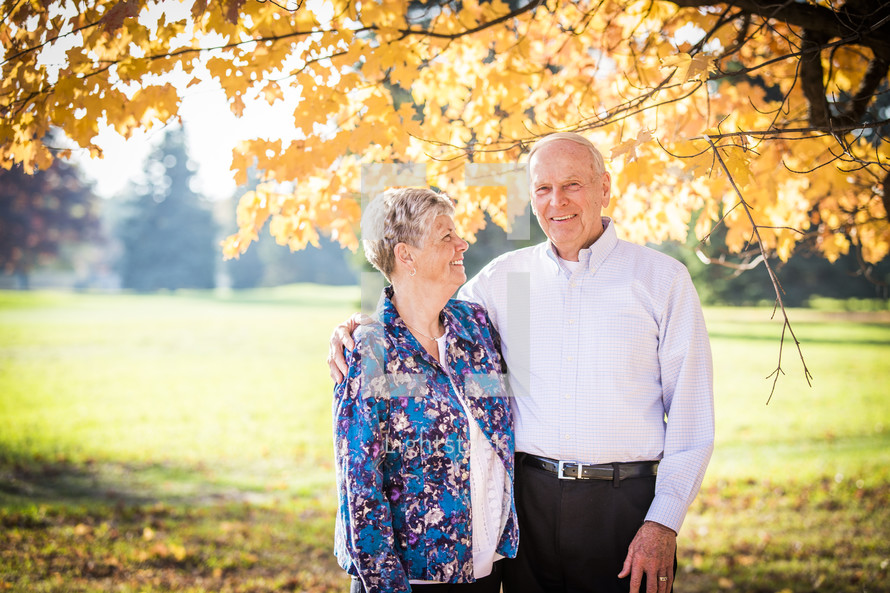 portrait of an elderly couple outdoors in fall 