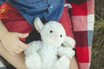 a toddler with his lambie 