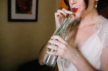 bride sipping out of a straw 