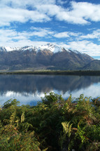 mountain range reflected in lake
