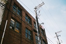 Power lines near an apartment building.