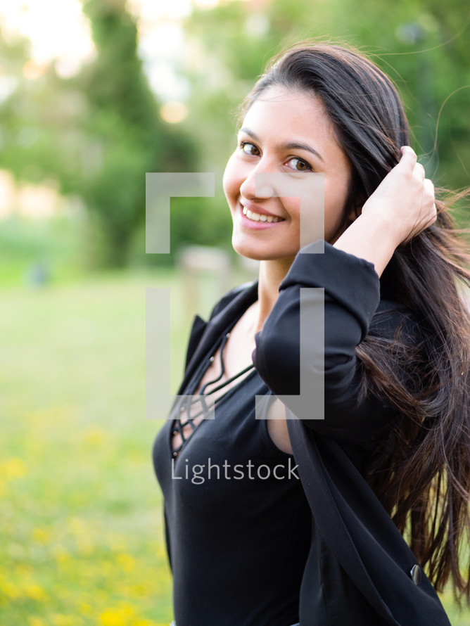 Woman in black shirt posing for the camera