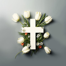 Cross with white tulips and Spring flowers